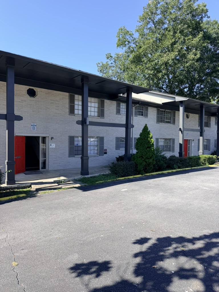 Extended view of the apartment building and covered walkway